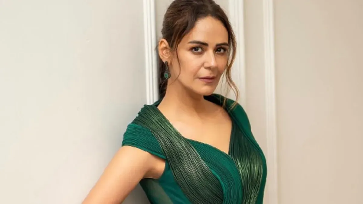 Mona Singh smiling and looking thoughtful.