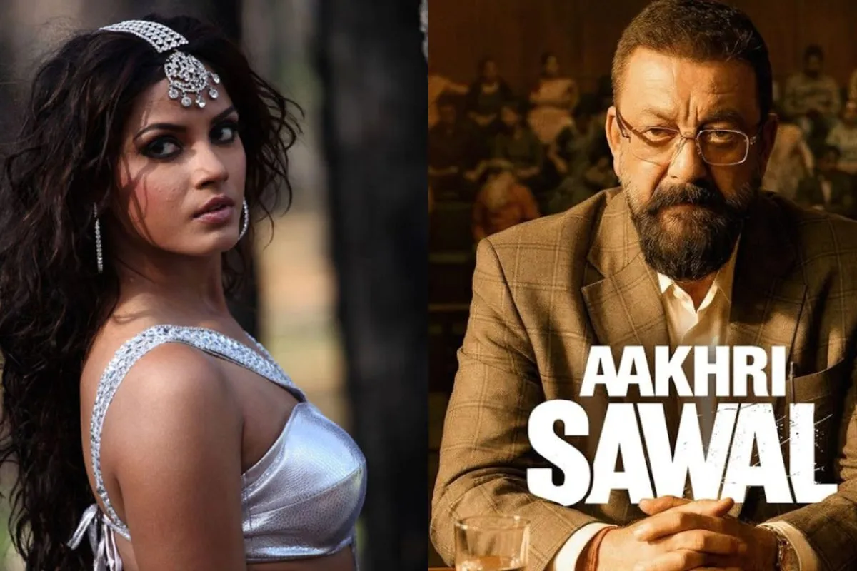 Neetu Chandra smiling warmly with Sanjay Dutt on a film set.