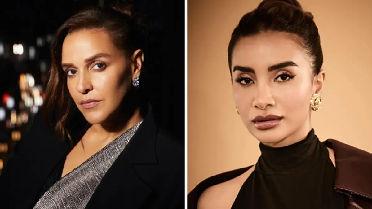 Actress Neha Dhupia looking supportive.