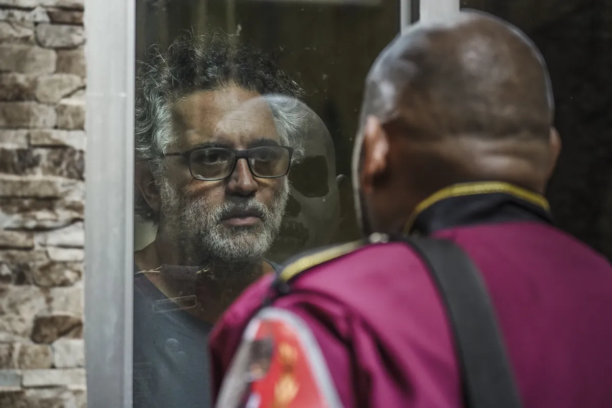 Abner Benaim accepts an award on stage.