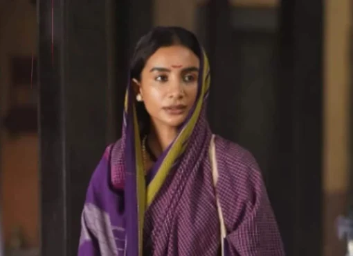 A smiling Patralekhaa, possibly from a film set or event, looking elegant and thoughtful.