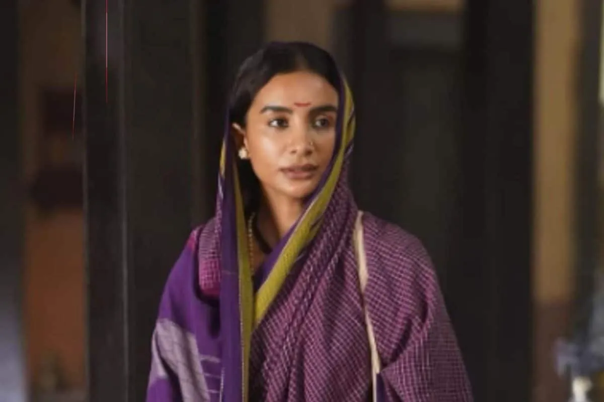 A smiling Patralekhaa, possibly from a film set or event, looking elegant and thoughtful.