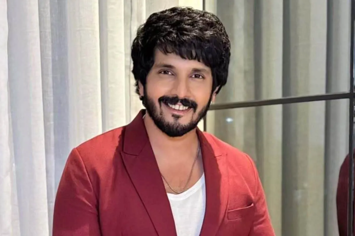 Kanwar Dhillon smiling.