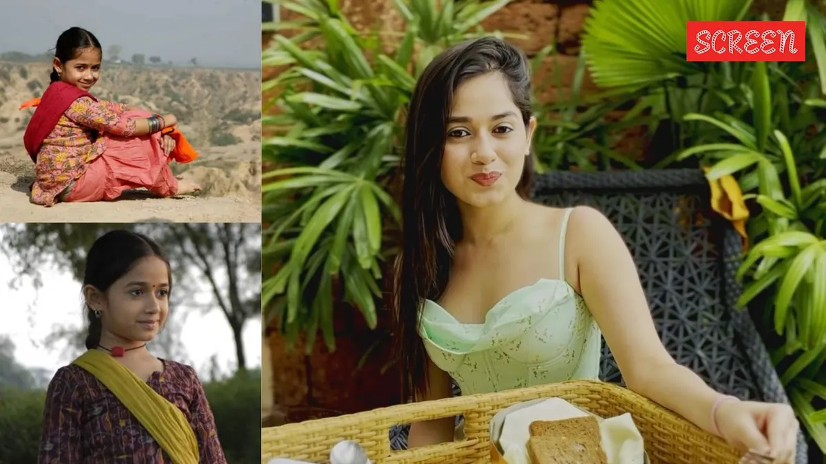 Jannat Zubair smiling confidently, looking successful and happy.