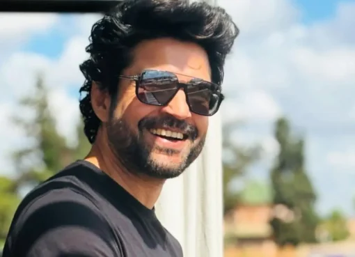Rajeev Khandelwal in a thoughtful pose, smiling slightly.