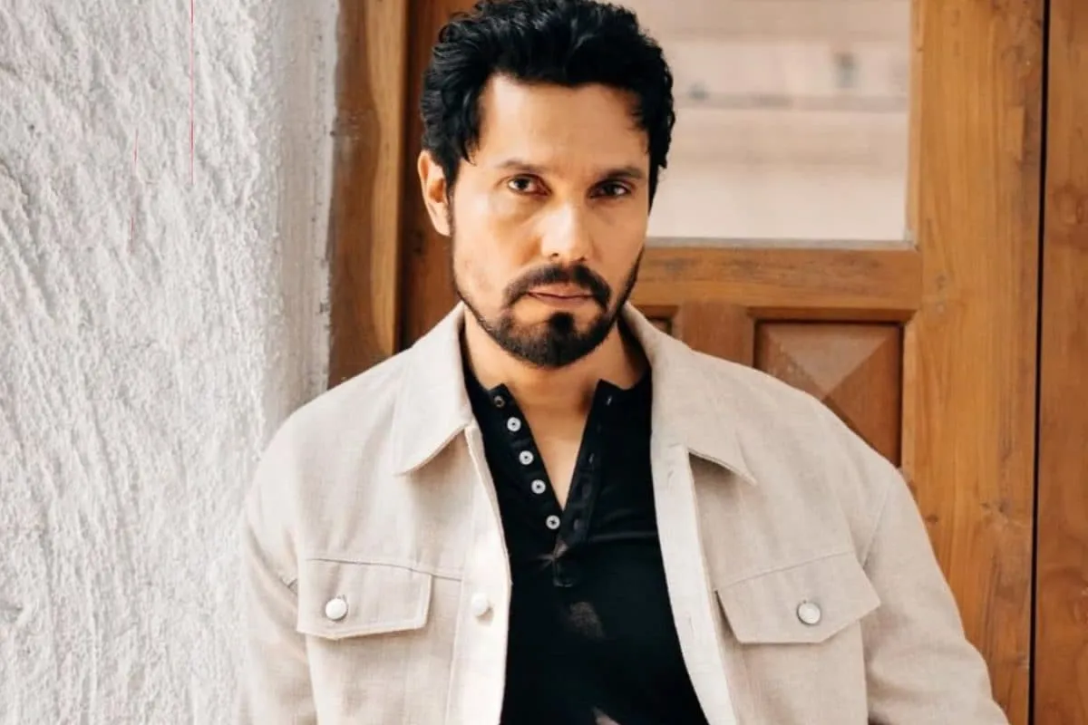 Randeep Hooda warmly interacts with his horses, Hope and Veer, in a stable setting.