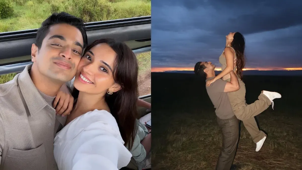 Ranveer Allahbadia and Juhi Bhatt smiling together in front of a scenic African landscape.
