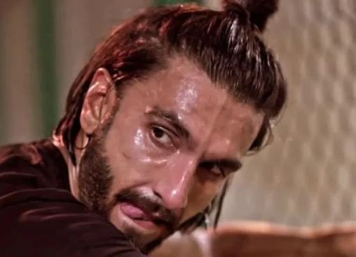 Ranveer Singh looking intense, possibly during a film shoot.