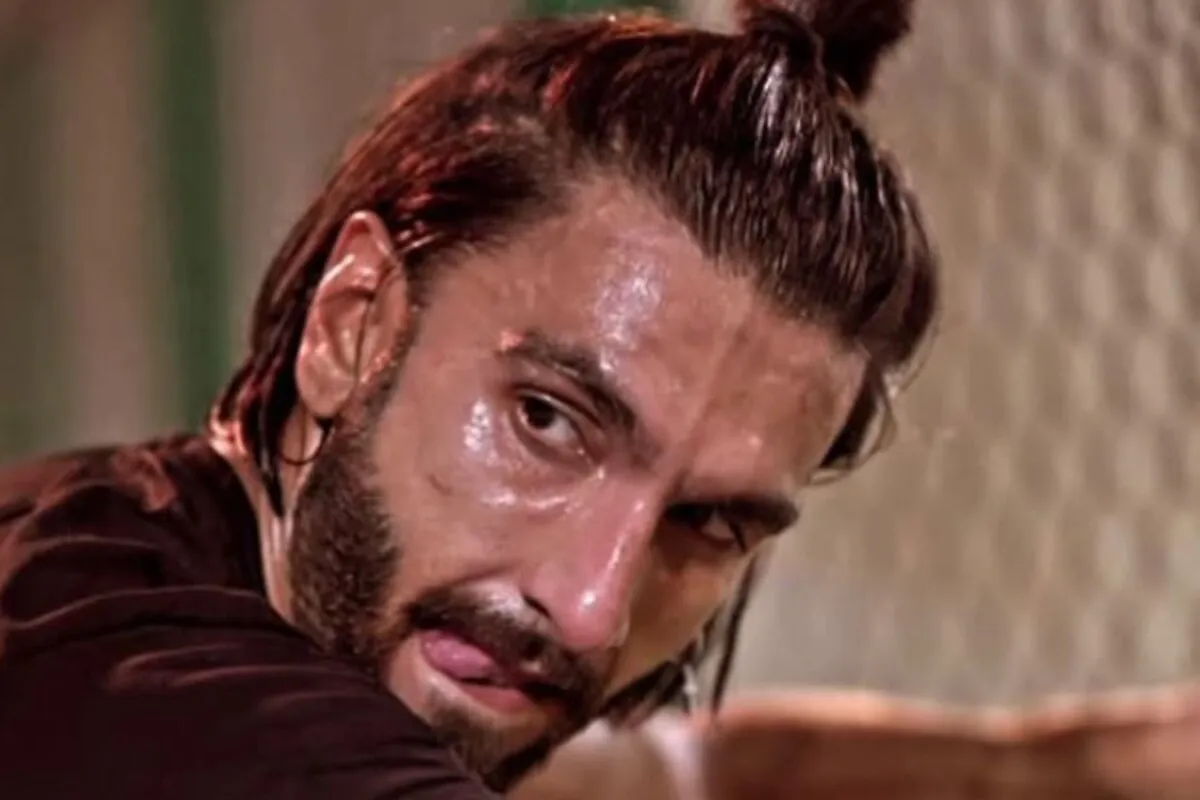 Ranveer Singh looking intense, possibly during a film shoot.
