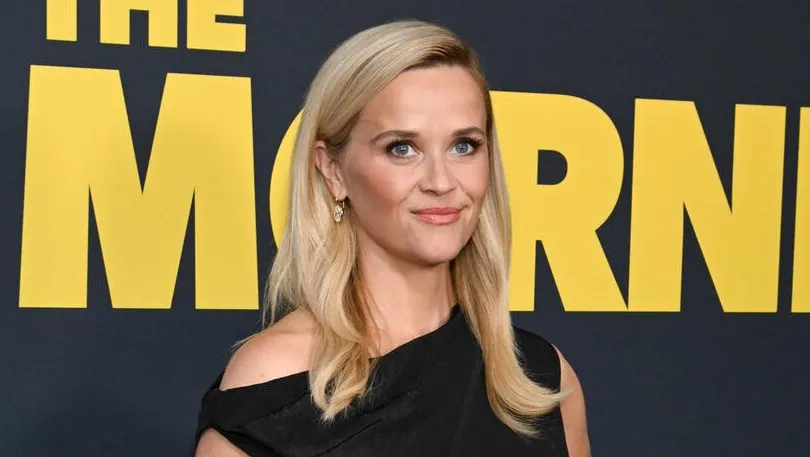 Reese Witherspoon looking smart and thoughtful at a press event.