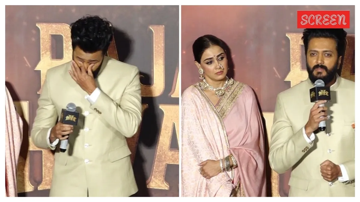 Riteish Deshmukh looking emotional on stage at a movie event