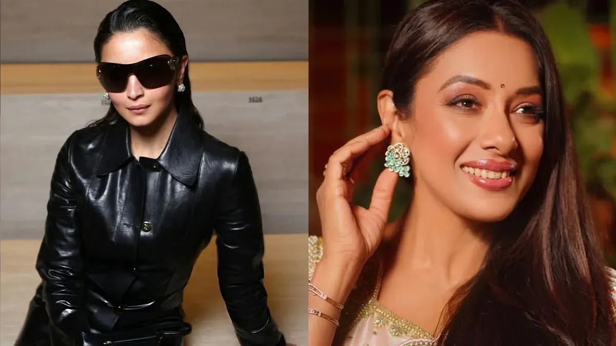 Alia Bhatt posing in a dark, structured Gucci leather outfit at Milan Fashion Week.