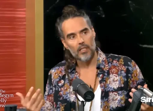 Russell Brand speaking intensely during an interview.