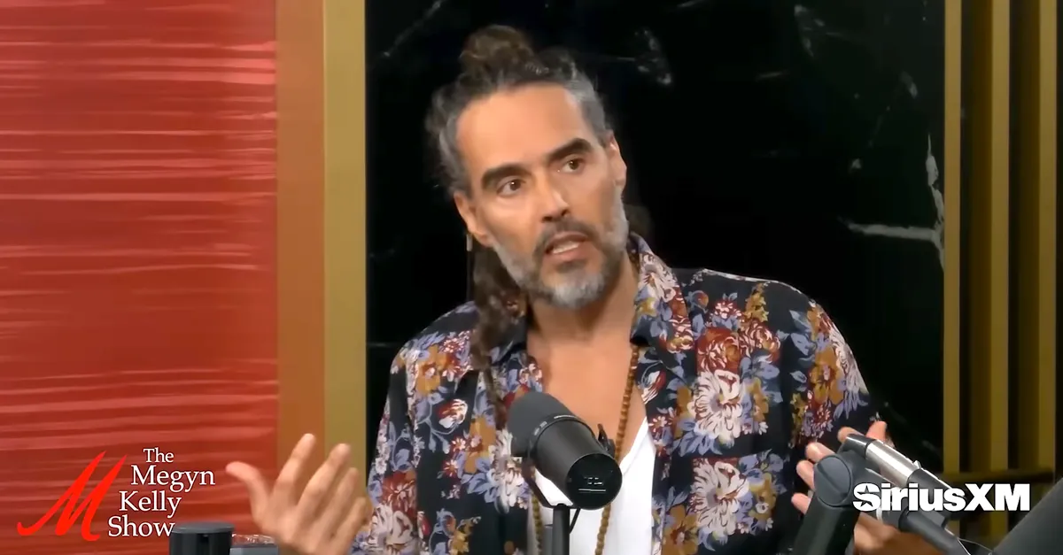 Russell Brand speaking intensely during an interview.