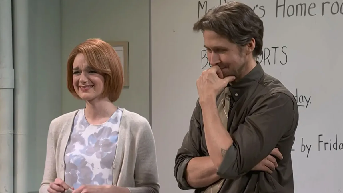 Ryan Gosling and Ashley Padilla laughing on the set of Saturday Night Live