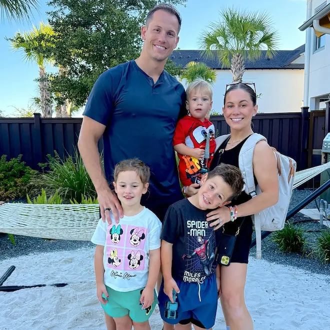 Shawn Johnson and Andrew East smiling together.