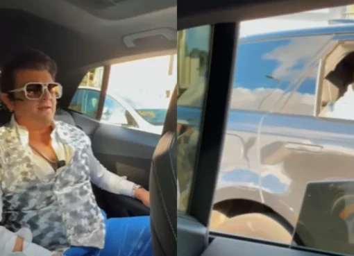 Sonu Nigam's car pulling up next to a fan's car with people inside looking excited.