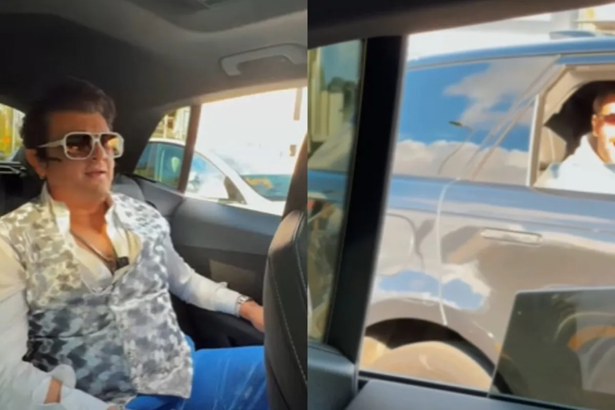 Sonu Nigam's car pulling up next to a fan's car with people inside looking excited.