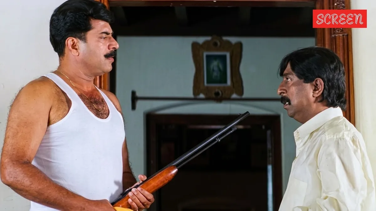 Sreenivasan and Mammootty sharing a stage and talking.