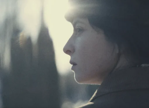 Agnes O'Casey looking serious in a spy-themed photo.