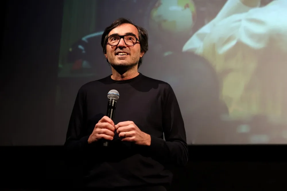 A minimalist graphic of Mubi's streaming interface showcasing diverse film titles and vibrant film stills.