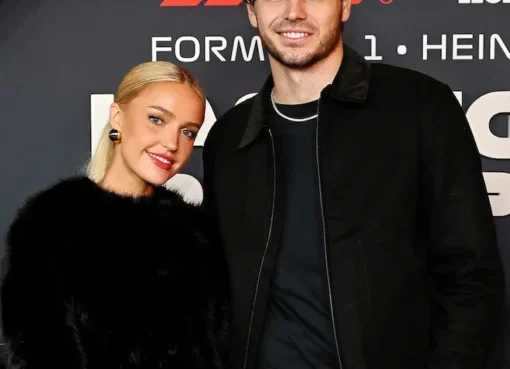 Taylor Fritz and Morgan Riddle smiling together.