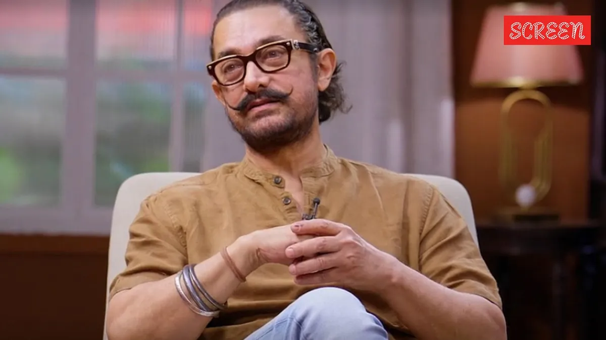 Aamir Khan in a pensive mood discussing personal life revelations.