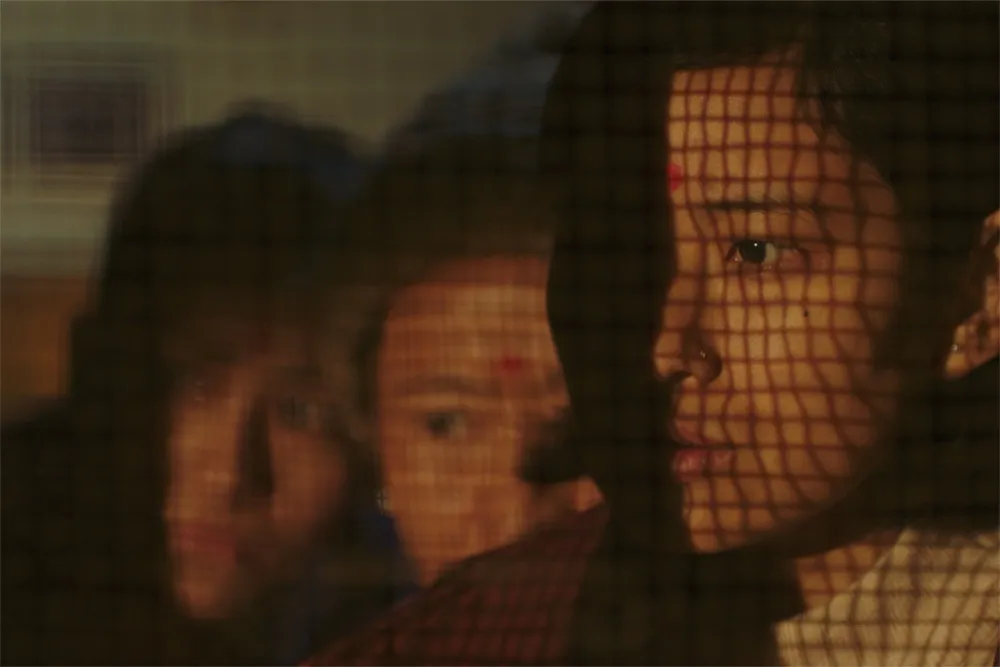 A still image from the film 'Shape of Momo' showing a character.