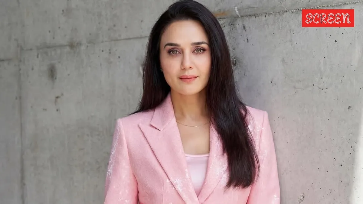 Preity Zinta smiling and looking confident at an IPL match