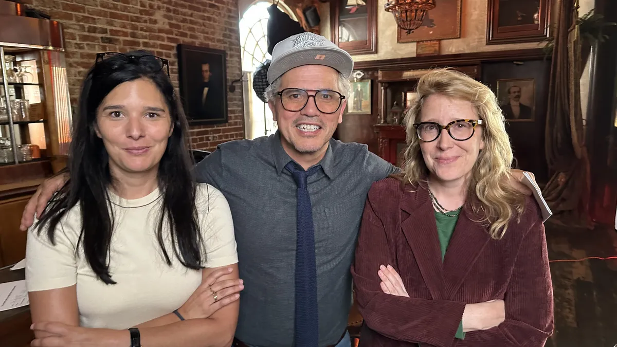 A vintage film reel with a movie title card that reads 'Beyond The Border: Latino Representation in Hollywood'