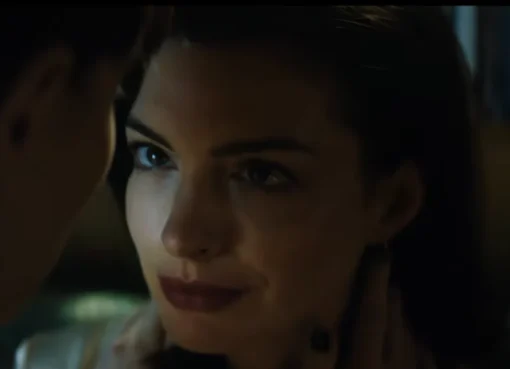 Anne Hathaway and Dakota Johnson looking intense in a dark room