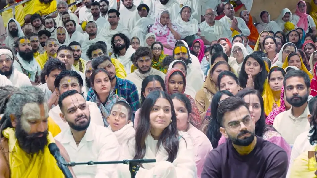 Virat Kohli and Anushka Sharma smiling at an ashram.