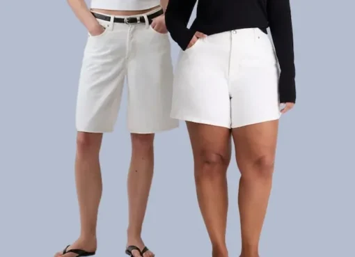 A person wearing stylish white denim shorts.
