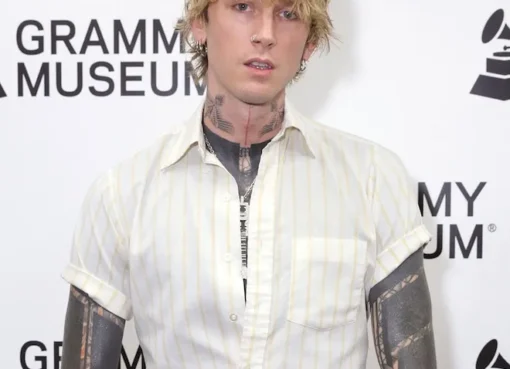 Photo of Machine Gun Kelly performing on stage.