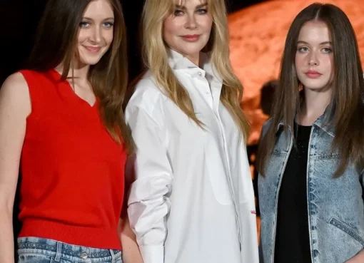 Nicole Kidman embraces her daughters, Sunday and Faith, in a warm, loving hug.