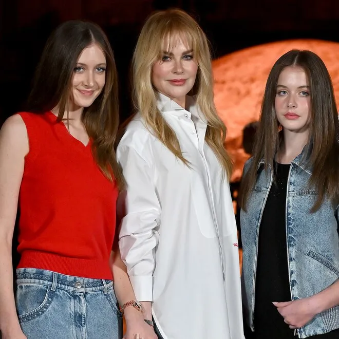 Nicole Kidman embraces her daughters, Sunday and Faith, in a warm, loving hug.