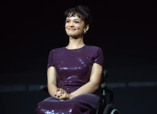 Marissa Bode, dressed as Glinda from Wicked, looking upset.