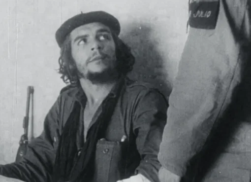A stark black and white image of Che Guevara's frail body laid on a table after his capture.