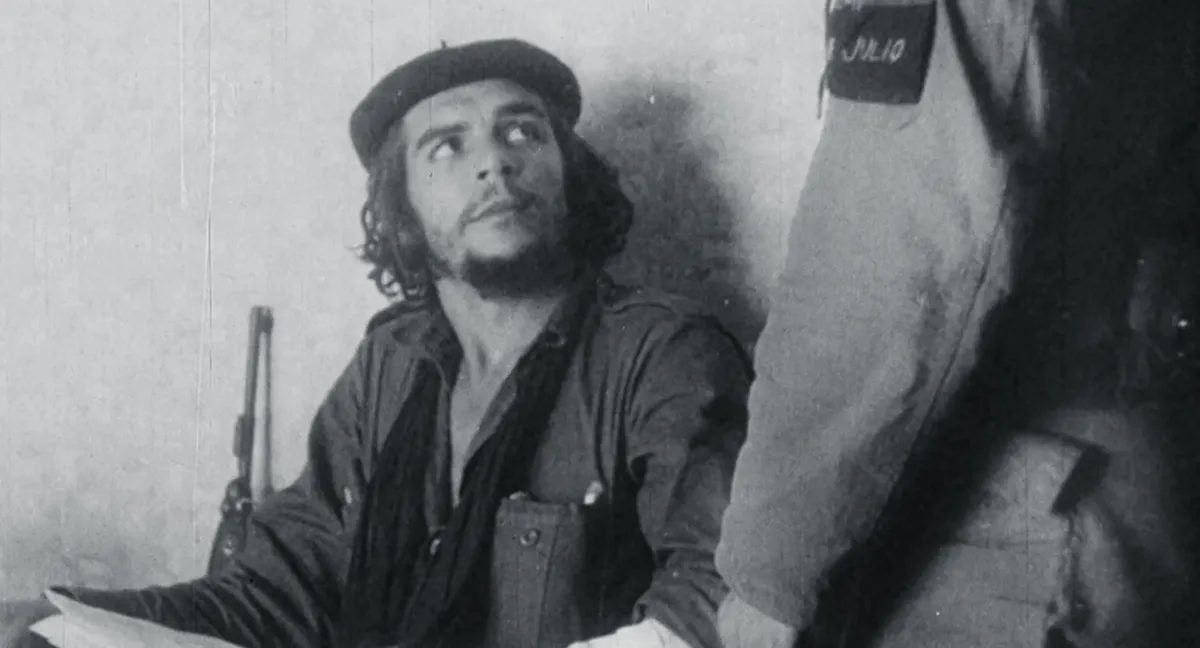 A stark black and white image of Che Guevara's frail body laid on a table after his capture.