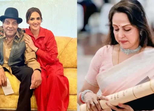 Hema Malini gracefully accepting the Padma Vibhushan award with a warm smile, likely for Dharmendra, at a formal ceremony.
