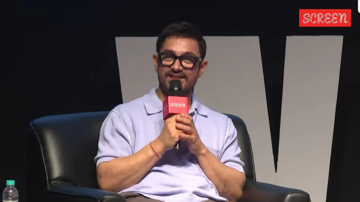 Aamir Khan looking thoughtful during a press interview about his films.