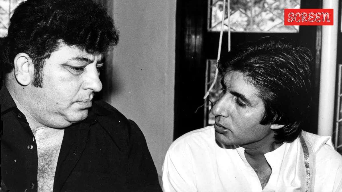 A vintage photo of Amitabh Bachchan and Amjad Khan smiling together on a film set.
