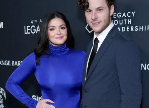 Ariel Winter and Nolan Gould posing together at an event.