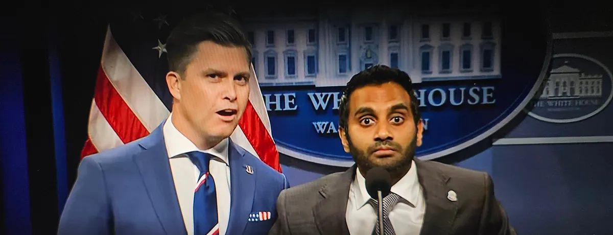 Aziz Ansari dressed as FBI Director Kash Patel in a comedic skit.