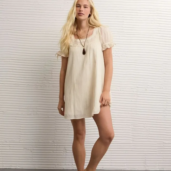 Olivia Rodrigo wearing a babydoll dress with a nostalgic, sweet aesthetic.