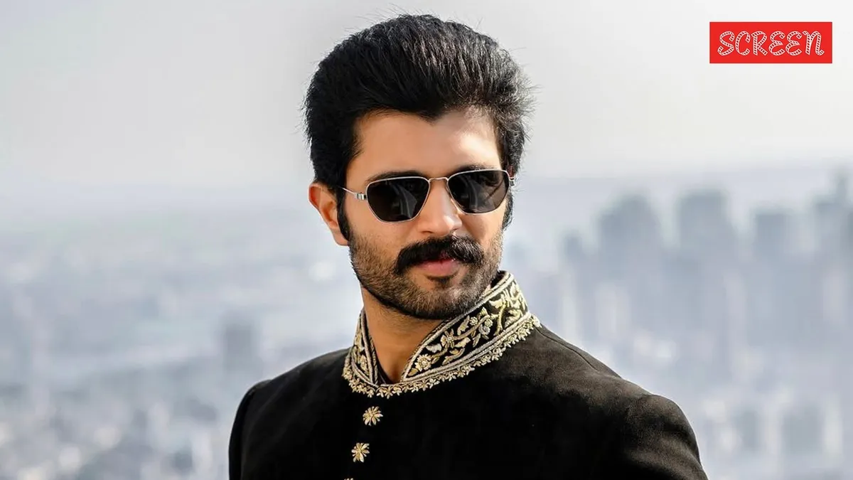 Vijay Deverakonda looking intense in a movie scene.