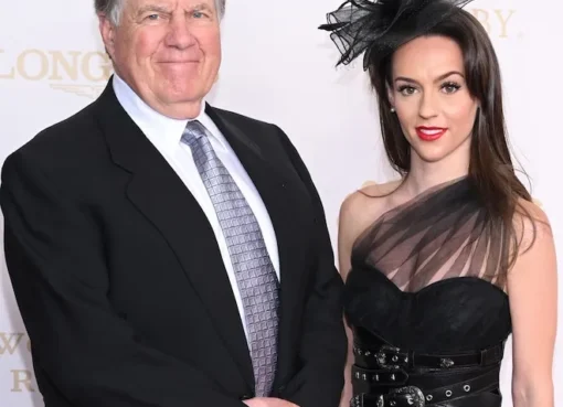 Bill Belichick and Jordon Hudson smiling together at the Kentucky Derby.