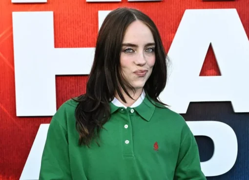 Billie Eilish smiling during an interview about her favorite TV shows.