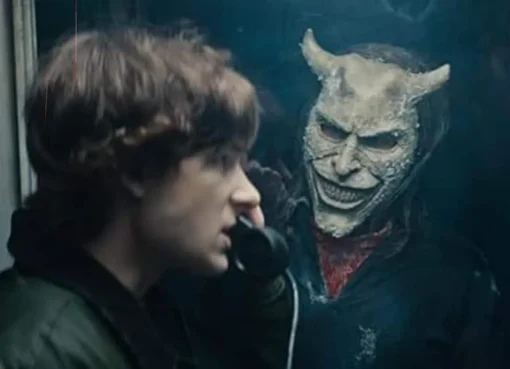 Still from the horror movie Black Phone 2 showing Ethan Hawke in his Grabber mask.