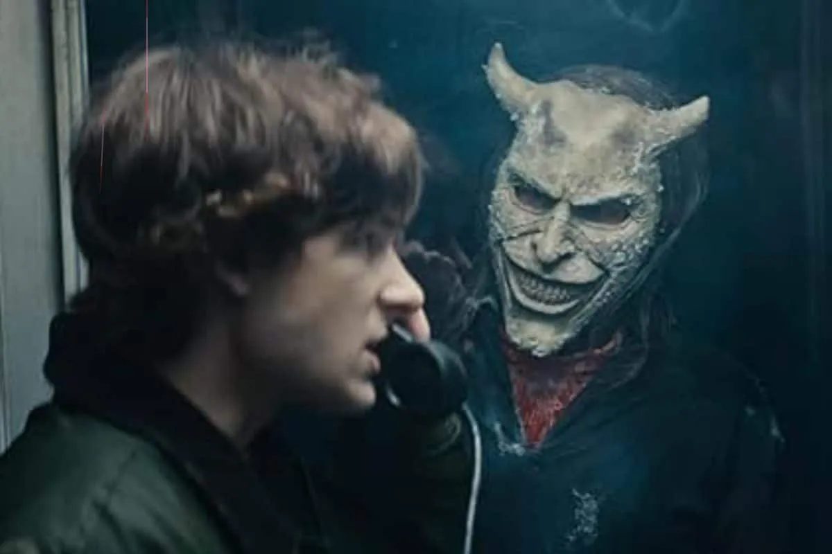 Still from the horror movie Black Phone 2 showing Ethan Hawke in his Grabber mask.